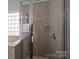 Large shower with glass enclosure and neutral tile at 1024 Knob Creek Ln, Fort Mill, SC 29708