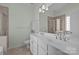 Double vanity bathroom with large mirror and shower at 1024 Knob Creek Ln, Tega Cay, SC 29708