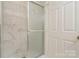 Modern bathroom with a walk-in shower and marble tile at 10240 Rose Meadow Ln # D, Charlotte, NC 28277