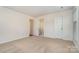 Spacious bedroom with carpeting, an ensuite bathroom, and plenty of light at 10240 Rose Meadow Ln # D, Charlotte, NC 28277