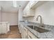 Clean and modern kitchen with granite countertops and stainless steel sink at 10240 Rose Meadow Ln # D, Charlotte, NC 28277