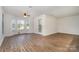 Spacious living room featuring hardwood floors and a bay window at 10240 Rose Meadow Ln # D, Charlotte, NC 28277