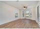 Living room with hardwood floors and a bay window at 10240 Rose Meadow Ln # D, Charlotte, NC 28277