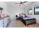 Well-lit bedroom with a twin bed, dresser, and wood floors at 109 Myers Port Way # 2, Mooresville, NC 28117