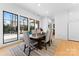 Bright dining room with modern table and chairs, overlooking the pool at 109 Myers Port Way # 2, Mooresville, NC 28117