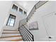 Modern staircase with black metal railing and natural light at 109 Myers Port Way # 2, Mooresville, NC 28117