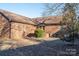 Brick home's backyard with patio and trees at 110 Robin Rd, Lincolnton, NC 28092