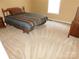 Bedroom showcasing neutral carpet, a twin bed with striped bedding, and natural light from a window at 110 Robin Rd, Lincolnton, NC 28092
