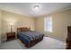 Bright bedroom with double bed, nightstand, and carpeted floor at 110 Robin Rd, Lincolnton, NC 28092