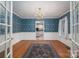 Bright dining room with hardwood floors, chandelier and view of kitchen at 110 Robin Rd, Lincolnton, NC 28092