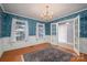 Formal dining room with hardwood floors, chandelier, and patterned wallpaper at 110 Robin Rd, Lincolnton, NC 28092