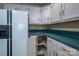 White cabinets and teal countertops in kitchen corner at 110 Robin Rd, Lincolnton, NC 28092