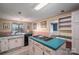 Kitchen features teal countertops, white cabinets, and an island at 110 Robin Rd, Lincolnton, NC 28092