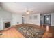 Living room featuring hardwood floors, a fireplace and large windows at 110 Robin Rd, Lincolnton, NC 28092