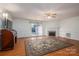 Living room with hardwood floors, fireplace, and sliding doors to patio at 110 Robin Rd, Lincolnton, NC 28092