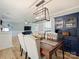 Elegant dining room with a dark blue hutch and chandelier at 1147 Bloom Wood Ln, Matthews, NC 28105