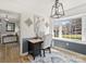 Bright home office with wood desk and window seat at 1147 Bloom Wood Ln, Matthews, NC 28105