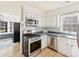 Modern kitchen with stainless steel appliances and updated countertops at 1147 Bloom Wood Ln, Matthews, NC 28105