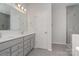 Elegant bathroom with double vanity, grey cabinets and a large shower at 12060 Mariners Cove Ct, Lancaster, SC 29720