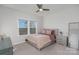 Spacious bedroom with large windows, neutral tones, and modern furniture at 12060 Mariners Cove Ct, Lancaster, SC 29720