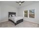 Cozy bedroom with a dark wood bed frame and windows offering wooded views at 12060 Mariners Cove Ct, Lancaster, SC 29720