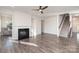 Living room with fireplace, hardwood floors, and a staircase at 12060 Mariners Cove Ct, Lancaster, SC 29720