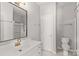 Updated bathroom featuring a white vanity, a large mirror, and a shower at 124 Zolder Ln # 15, Mooresville, NC 28117