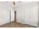 Bedroom with double doors and wood-look floors at 124 Zolder Ln # 15, Mooresville, NC 28117