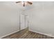 Bright bedroom with wood-look flooring and ceiling fan at 124 Zolder Ln # 15, Mooresville, NC 28117