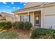 Front entry with a blue door and stone porch at 124 Zolder Ln # 15, Mooresville, NC 28117