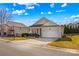 Tan house with a white garage door and driveway at 124 Zolder Ln # 15, Mooresville, NC 28117