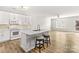 Open concept kitchen with white cabinets and island at 124 Zolder Ln # 15, Mooresville, NC 28117