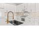 Modern kitchen with white cabinets and gold faucet at 124 Zolder Ln # 15, Mooresville, NC 28117