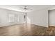 Bright living room featuring wood-look floors, a ceiling fan, and access to a deck at 124 Zolder Ln # 15, Mooresville, NC 28117