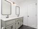 Updated bathroom with double vanity and modern fixtures at 14023 Kedleston Rd, Huntersville, NC 28078