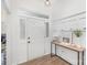 Bright entryway with white wainscoting and console table at 14023 Kedleston Rd, Huntersville, NC 28078