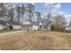 Brick and white sided ranch home with gray garage door at 14023 Kedleston Rd, Huntersville, NC 28078