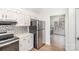 Kitchen features white cabinets and stainless steel appliances at 14023 Kedleston Rd, Huntersville, NC 28078