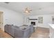 Living room with L-shaped sectional sofa and fireplace at 14023 Kedleston Rd, Huntersville, NC 28078