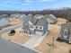 Two-story house, gray roof, blue and beige siding, front yard landscaping, driveway at 1503 Brooksland Pl, Waxhaw, NC 28173