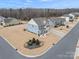 Two-story house, gray roof, blue siding, front yard landscaping, neighborhood view at 1503 Brooksland Pl, Waxhaw, NC 28173