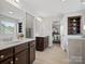 Bathroom with large vanity, bathtub, and walk-in shower at 1503 Brooksland Pl, Waxhaw, NC 28173