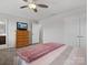 Main bedroom with dresser, TV, and ensuite bathroom access at 1503 Brooksland Pl, Waxhaw, NC 28173