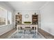 Bright home office features built-in shelving and hardwood floors at 1503 Brooksland Pl, Waxhaw, NC 28173