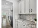 Kitchen boasts granite countertops and white cabinetry at 1503 Brooksland Pl, Waxhaw, NC 28173