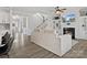 Living room with fireplace, built-in shelving, and hardwood floors at 1503 Brooksland Pl, Waxhaw, NC 28173