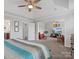 Main bedroom with sitting area and large TV at 1503 Brooksland Pl, Waxhaw, NC 28173