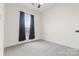 Bright bedroom with neutral walls and carpeted floors at 1554 Kee Ct, Charlotte, NC 28203