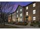 Three-story townhome with gray and brick exterior, and a modern design at 1554 Kee Ct, Charlotte, NC 28203