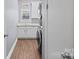 Bright laundry room with white cabinets and stylish flooring at 162 Ravencrest Dr, Statesville, NC 28625